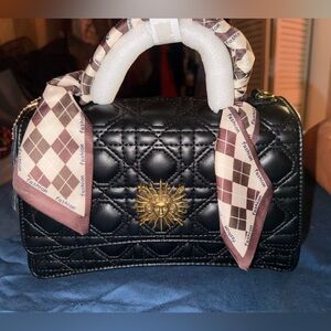 black quilted handbag w gold-tone sunburst medallion and scarf accent handle